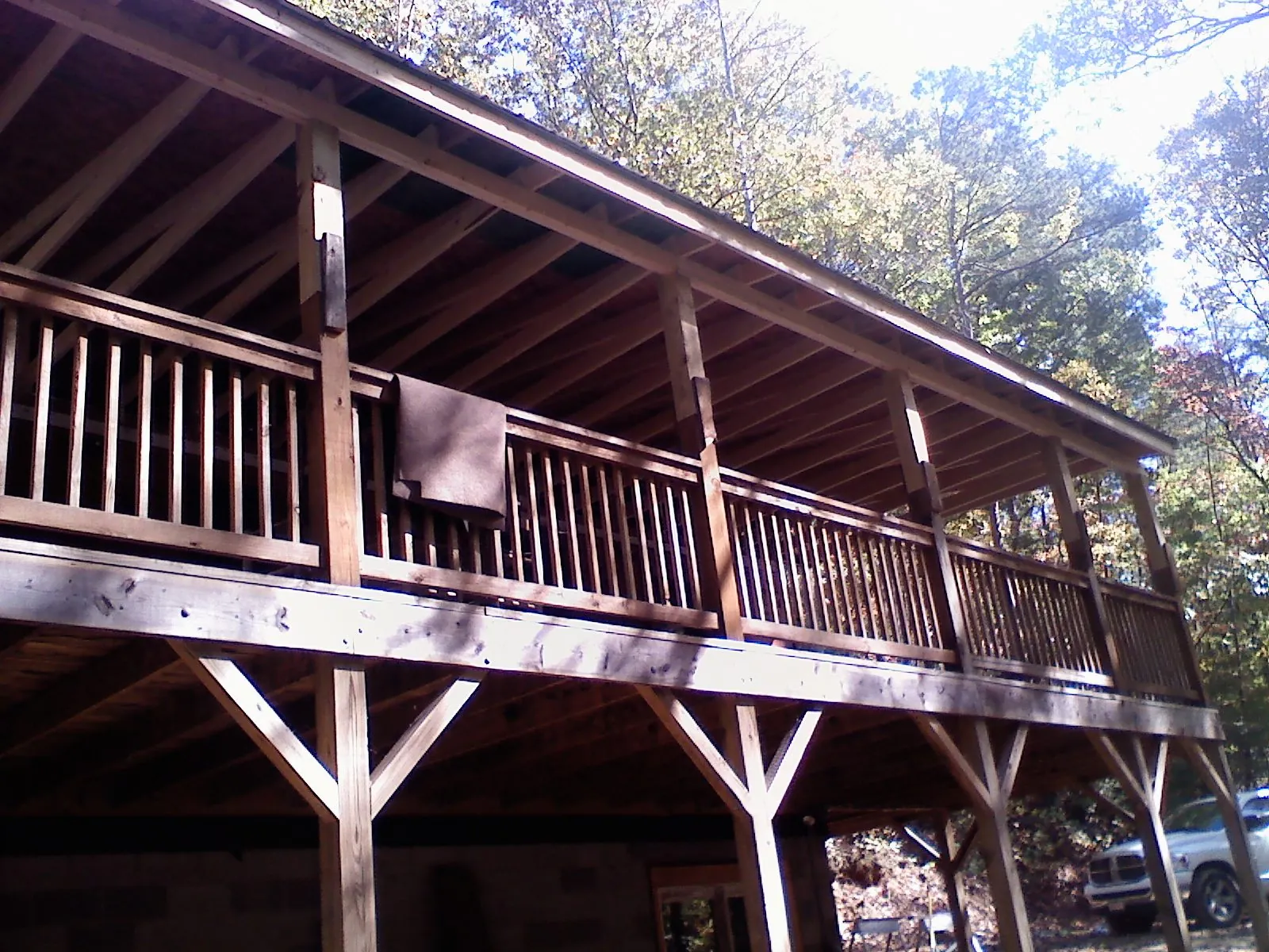 Timber framing under a new elevated porch and deck — Roof Leak Repair in Martensdale by Roofing Brothers
